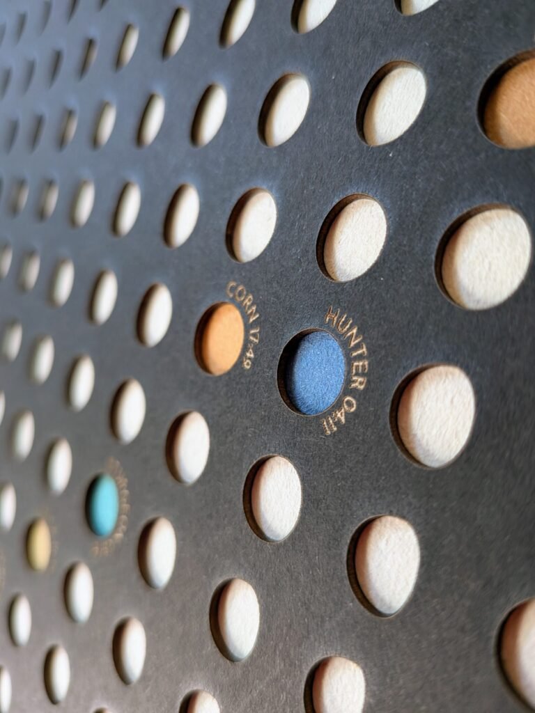 Close-up of Moon Phase Lunar Calendar – Shadow Edition, detail of crescent and full moon design and engraved text.