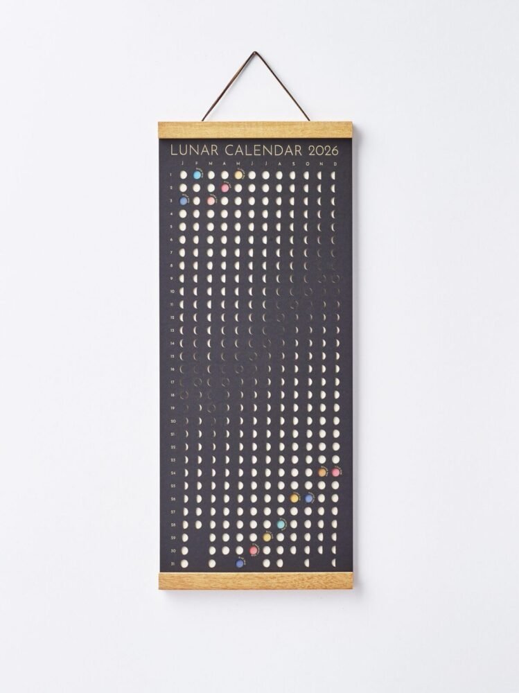 Moonatics | Lunar Calendar 2026 Shadow Edition Moon Phase Lunar Calendar – Shadow Edition hanging on wall with teak magnetic poster frame, modern minimalist home décor.