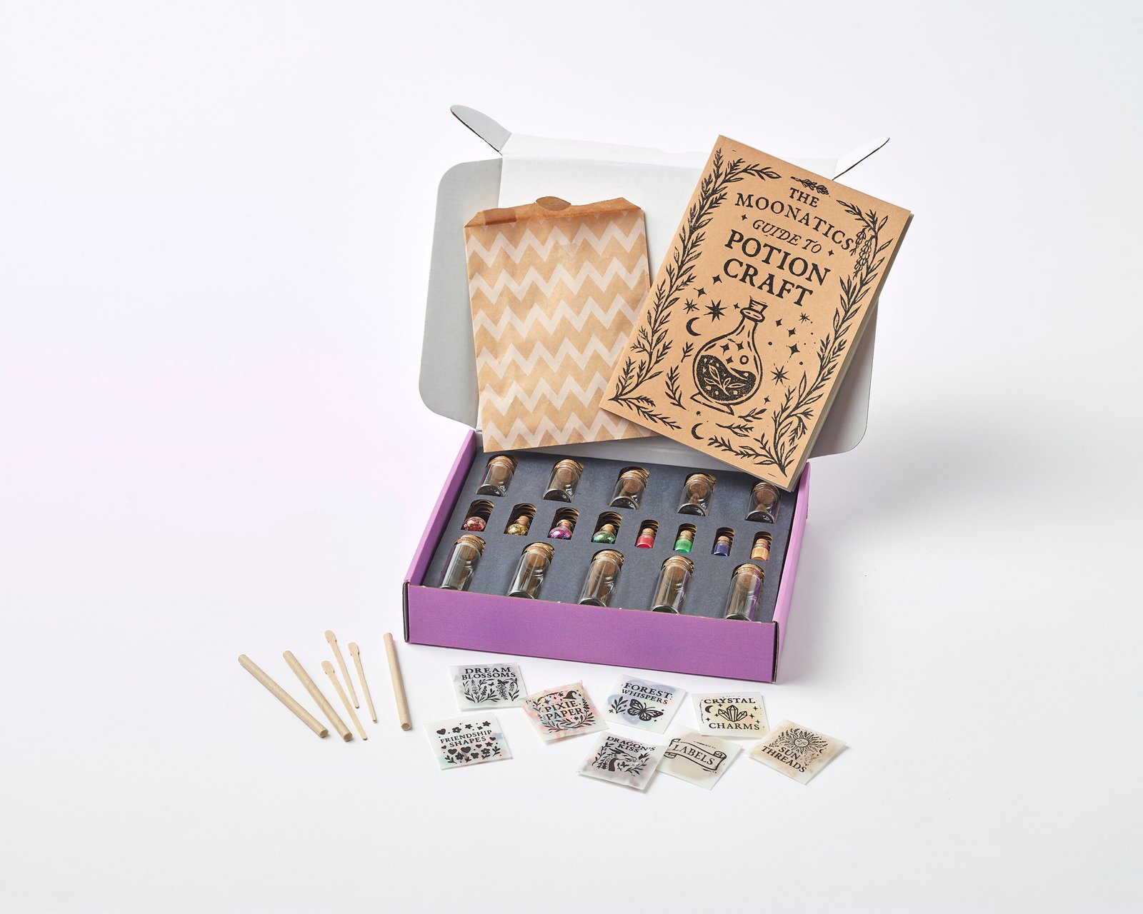 Moonatics Alchemist Eco Potion Kit — potion bottles filled with mica powder, biodegradable glitter, and natural magical mix-ins.