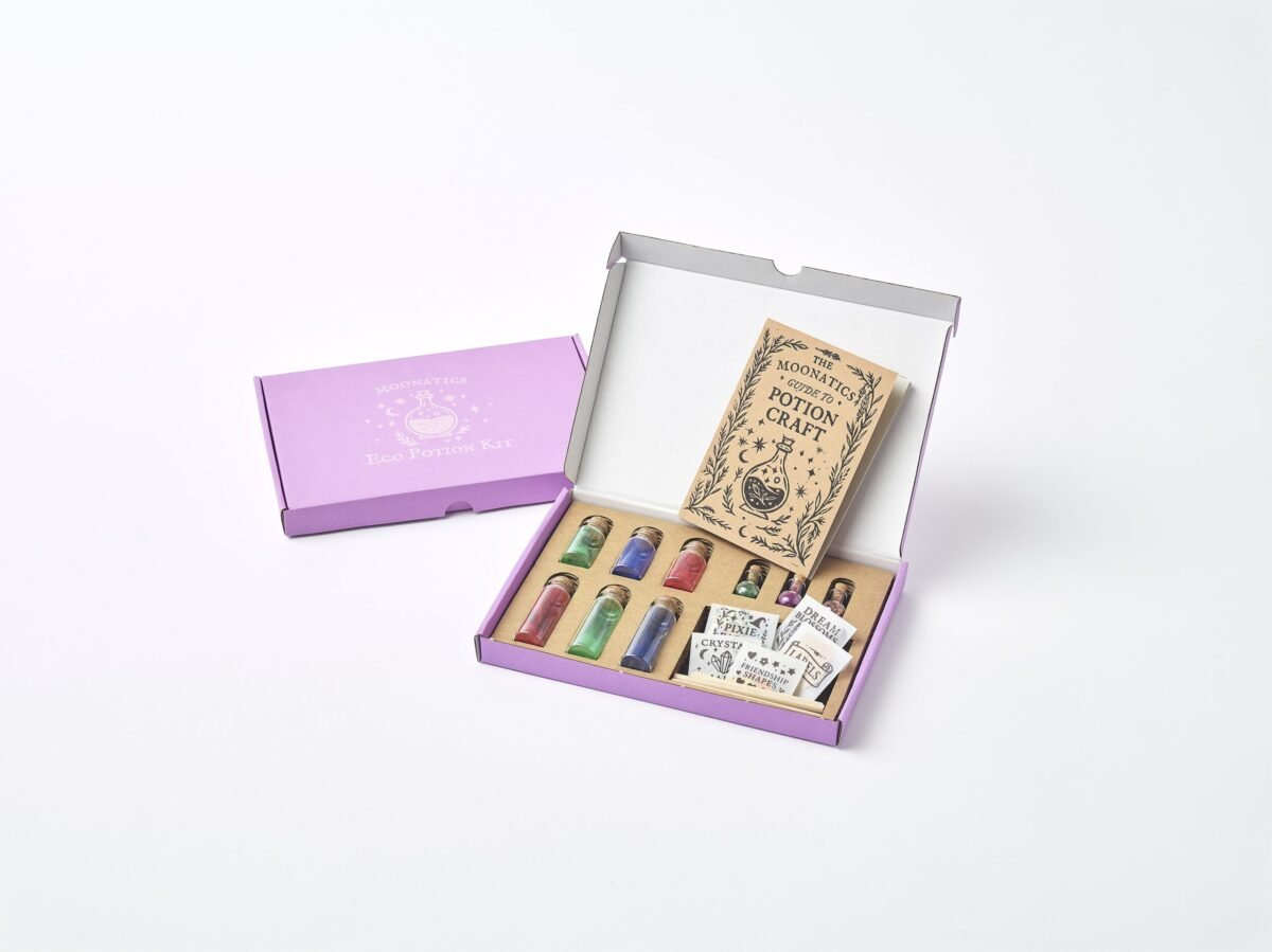 Apprentice Eco Potion Kit contents — potion bottles filled with mica powder, biodegradable glitter, and natural magical mix-ins.