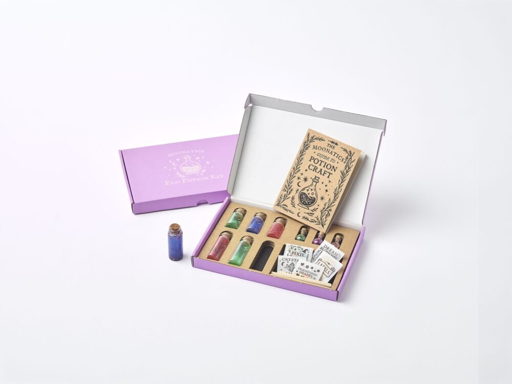 Apprentice Eco Potion Kit contents — potion bottles filled with mica powder, biodegradable glitter, and natural magical mix-ins.