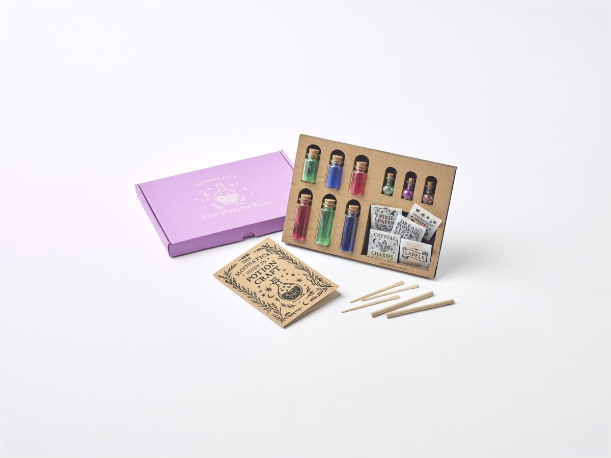 Apprentice Eco Potion Kit contents — potion bottles filled with mica powder, biodegradable glitter, and natural magical mix-ins.