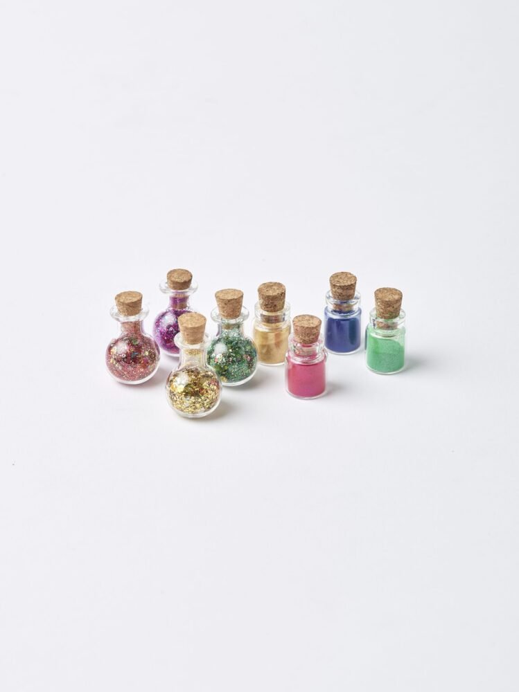 Small potion bottles of eco glitter and mica powder