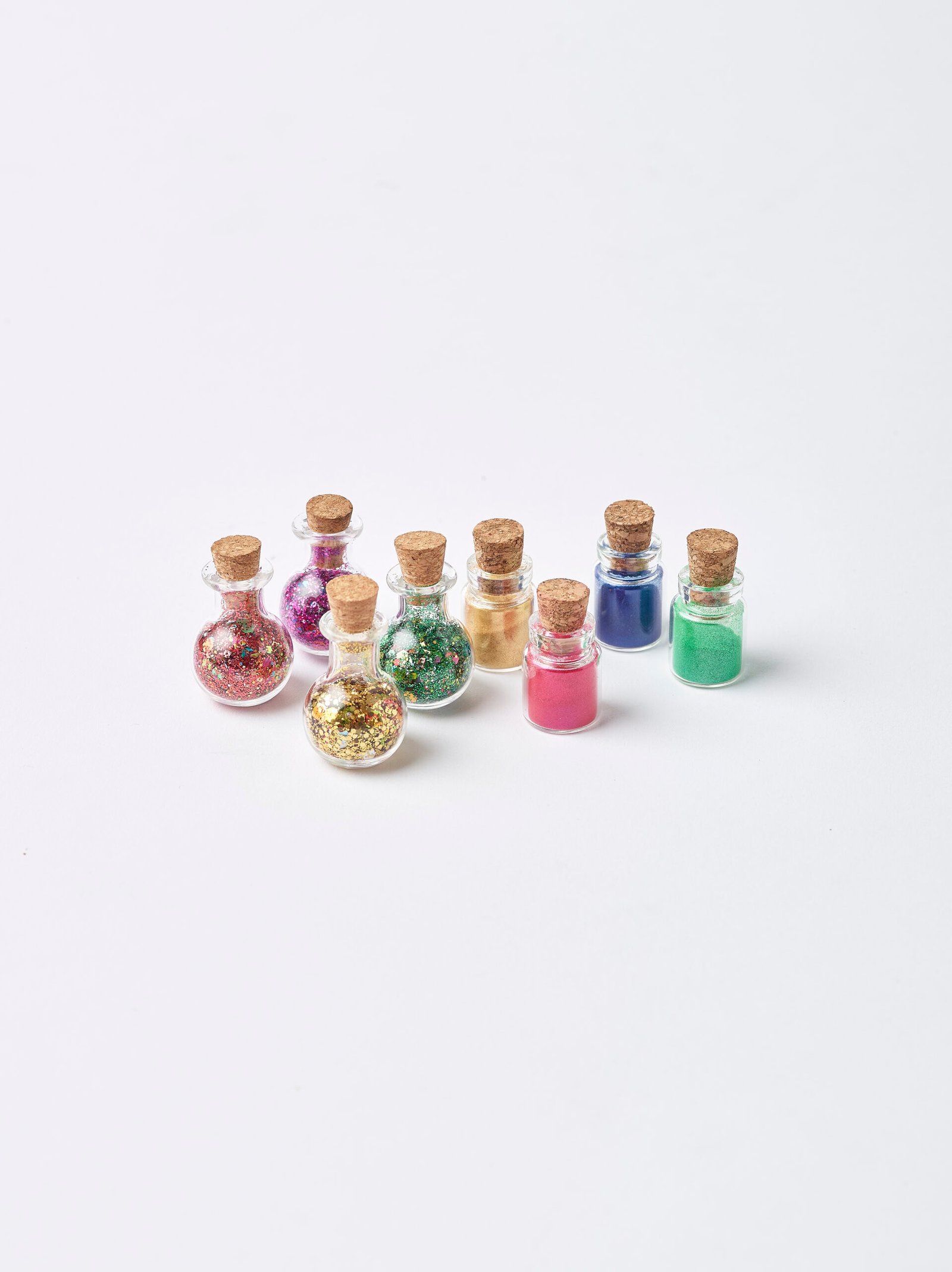 Small potion bottles of eco glitter and mica powder