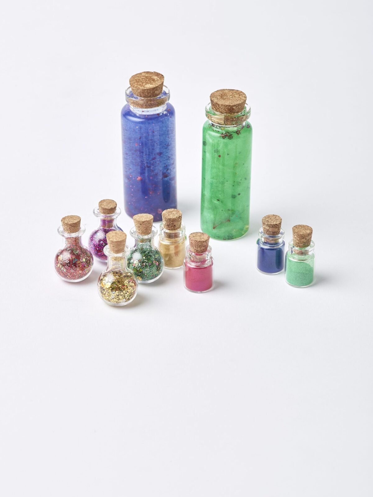 Small potion bottles of eco glitter and mica powder
