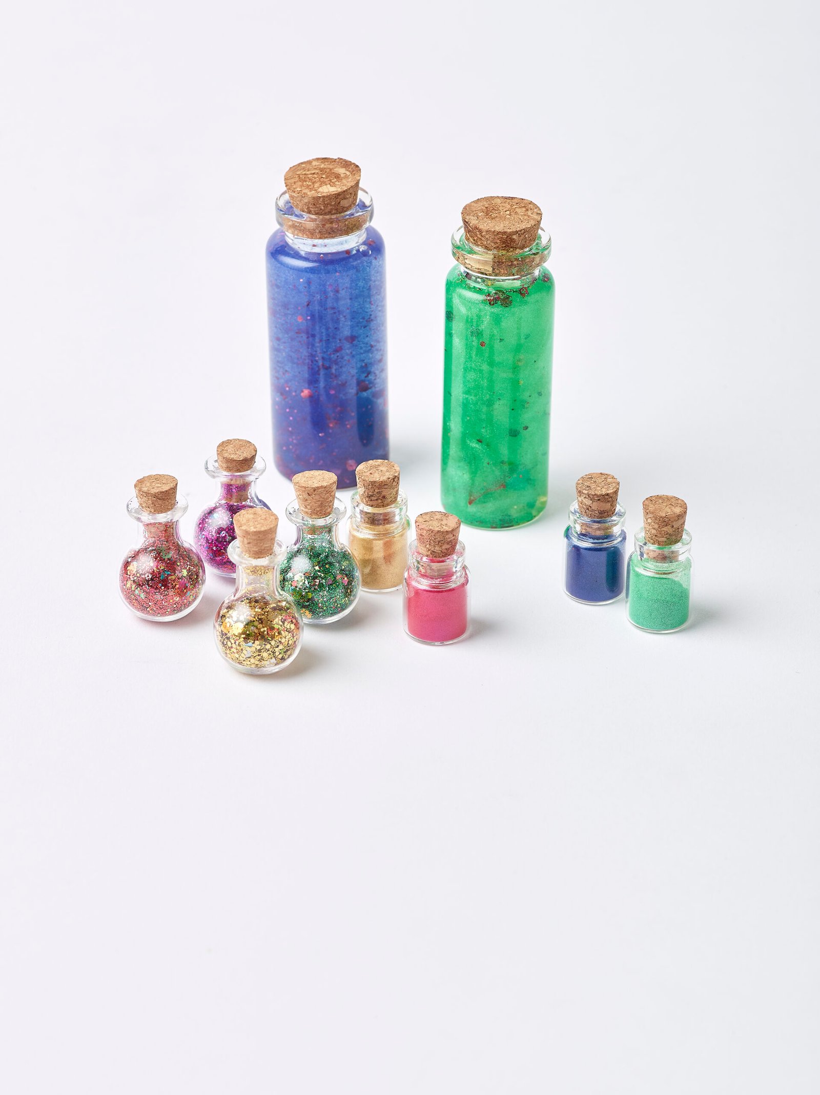 Small potion bottles of eco glitter and mica powder