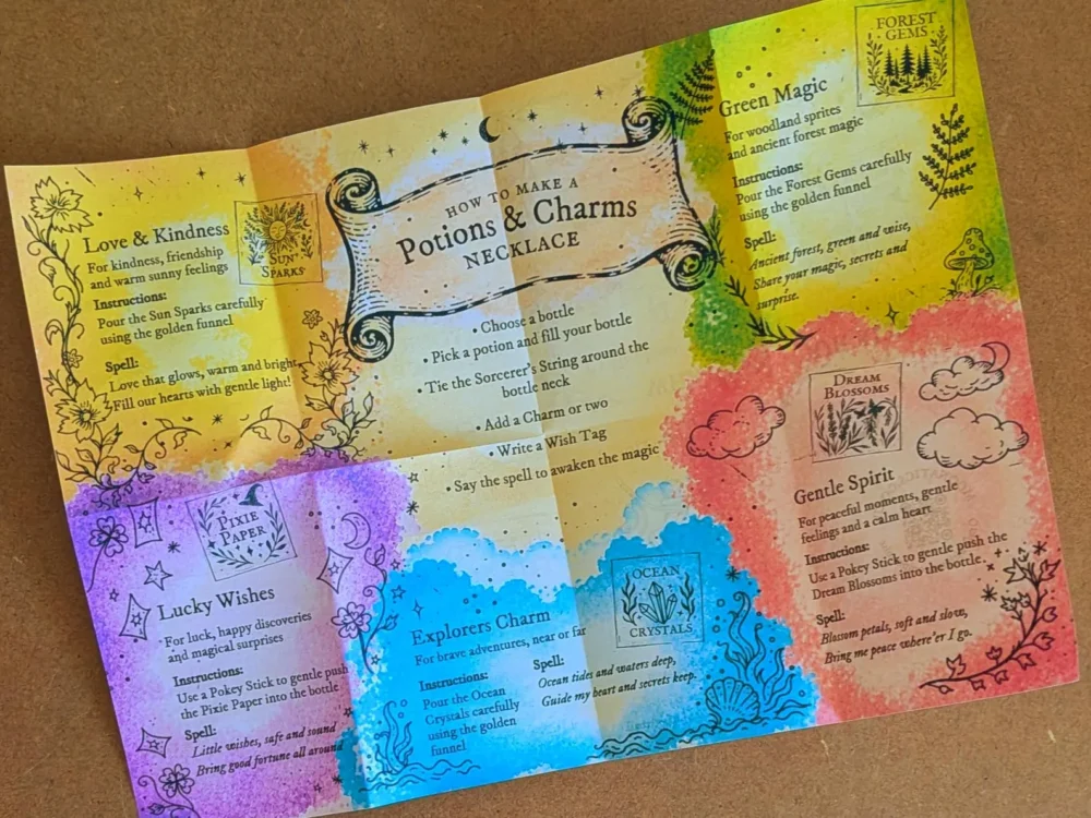 Open fold-out instruction booklet from the Potion & Charms Necklace Kit featuring colourful potion recipes, magical spells and illustrated necklace making instructions.