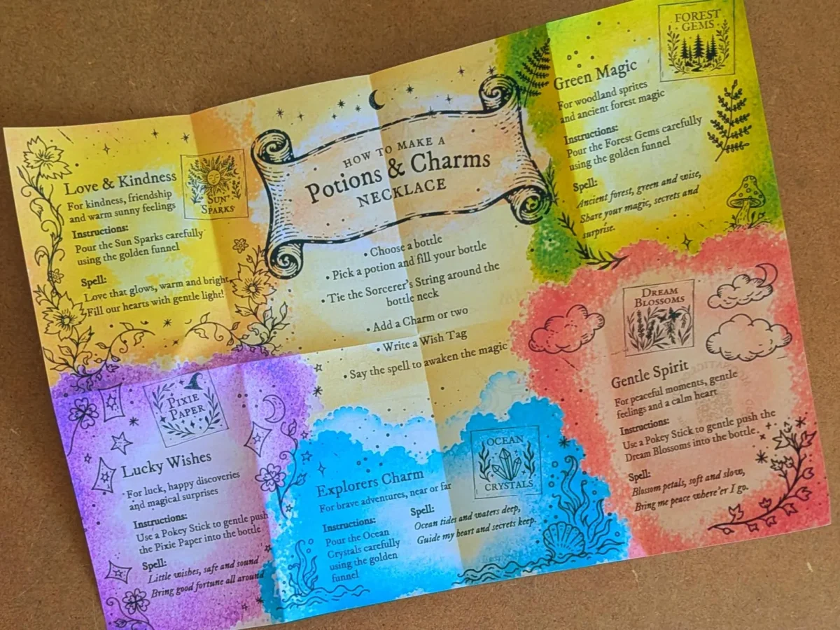 Open fold-out instruction booklet from the Potion & Charms Necklace Kit featuring colourful potion recipes, magical spells and illustrated necklace making instructions.