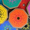 necklace_box_tops Collection of colourful Potion & Charms Necklace Kit gift boxes arranged together, showing bright laser-cut designs in blue, pink, yellow, orange and purple.