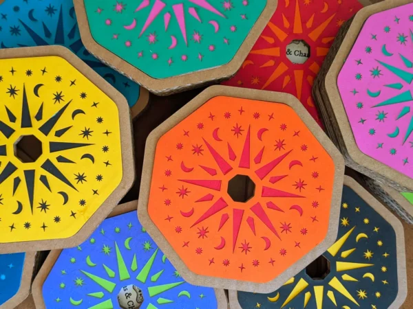 necklace_box_tops Collection of colourful Potion & Charms Necklace Kit gift boxes arranged together, showing bright laser-cut designs in blue, pink, yellow, orange and purple.