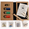 Open Moonatics Eco Potion Kit showing glass bottles of colourful potion powders, eco glitter, illustrated instruction booklet, stirring sticks and packets of Crystal Charms, Friendship Shapes, Dream Blossoms and Labels.