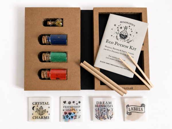 Open Moonatics Eco Potion Kit showing glass bottles of colourful potion powders, eco glitter, illustrated instruction booklet, stirring sticks and packets of Crystal Charms, Friendship Shapes, Dream Blossoms and Labels.